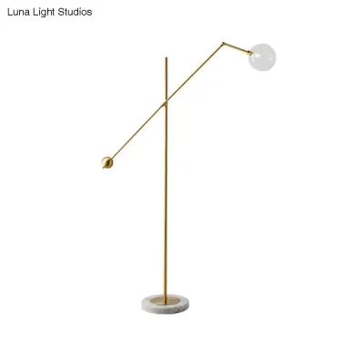 Modernist Gold Metal Balance Arm Task Floor Lamp with Orb Design – Single Bulb Standing Light for Office