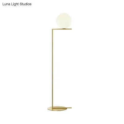 Minimalist Gold Orb Floor Lamp with Frosted Glass Shade and Right Angle Stand