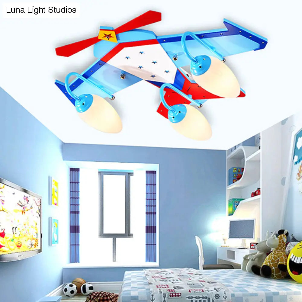 Lámpara de techo empotrada en color azul para niños con pantalla de cristal color crema ovalada, lámpara de techo empotrada en forma de plano de madera con acabado de madera