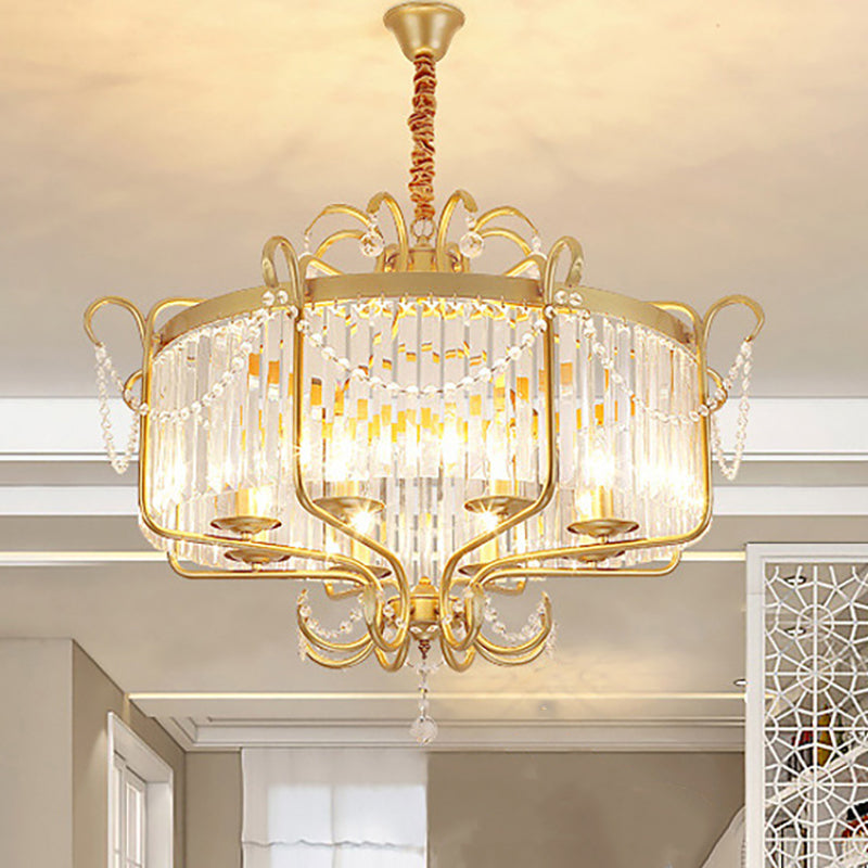 Gold-coloured lantern chandelier with clear crystal prisms shown over a dining setting