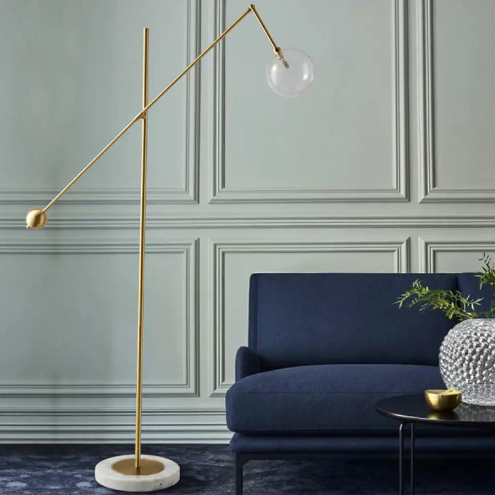 Modernist Gold Metal Balance Arm Task Floor Lamp with Orb Design – Single Bulb Standing Light for Office