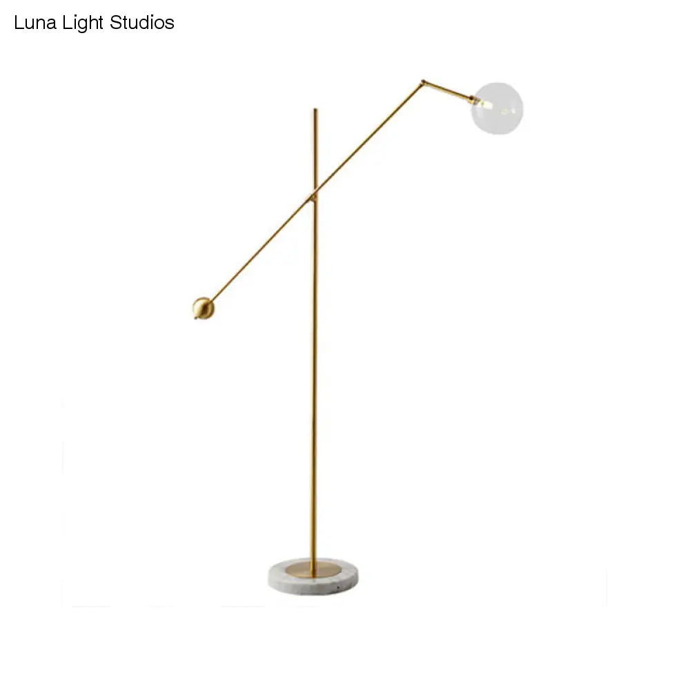 Modernist Gold Metal Balance Arm Task Floor Lamp with Orb Design – Single Bulb Standing Light for Office