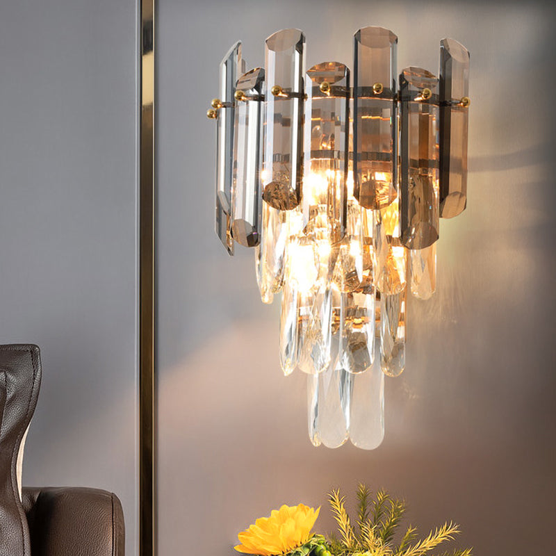 Tiered wall sconce with clear and smoky grey crystal pieces