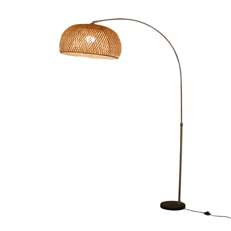 Bamboo-shade arc floor lamp with a slim curved stand and round base
