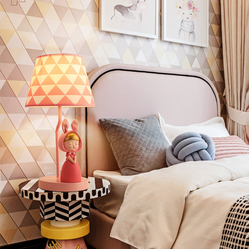 Kids' Pink Fabric Drum Table Lamp with Resin Figurine - Tapered Design for Bedroom Nightstand