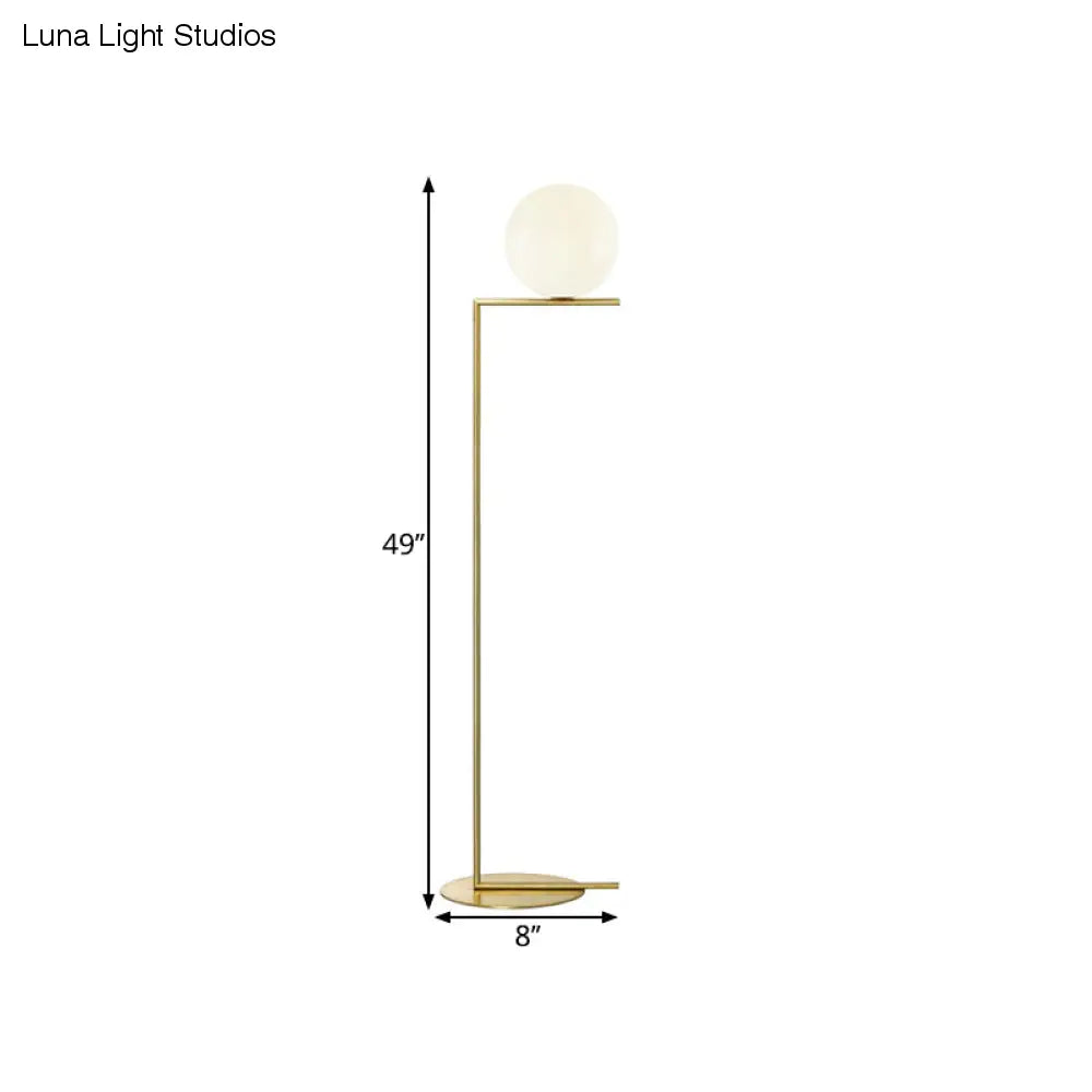 Minimalist Gold Orb Floor Lamp with Frosted Glass Shade and Right Angle Stand